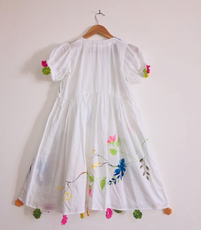 Flora And Fauna Design With Crochet Flowers On White Dress